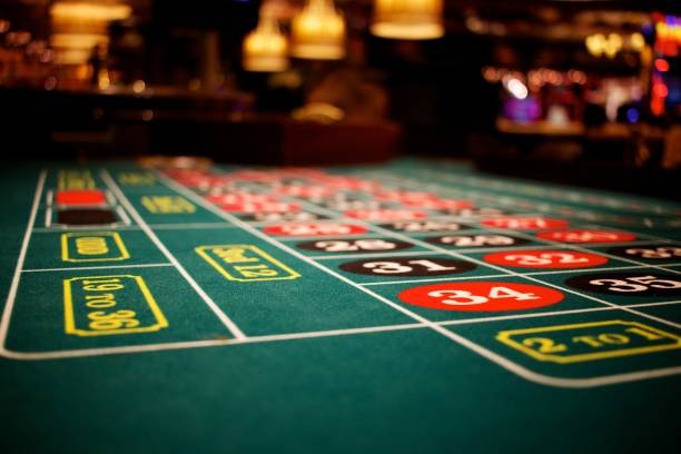 omen roulette table interface showing betting layout, live wheel spin, and player balance display
